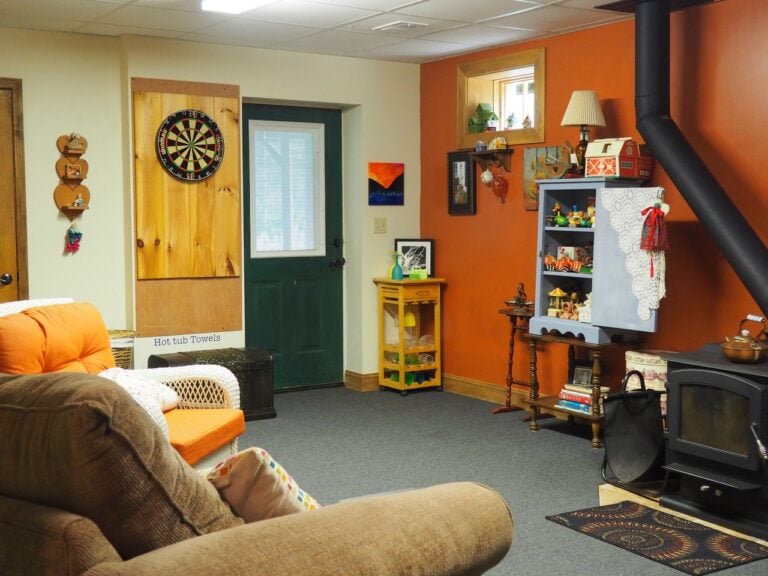 Guest game room with darts and seating at Bedford Landings Bed and Breakfast