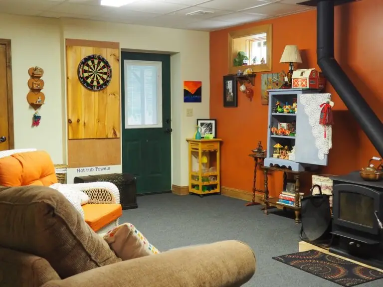 Guest game room with darts and seating at Bedford Landings Bed and Breakfast