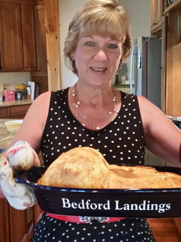 Bedford Landings host preparing and serving breakfast for guests near Smith Mountain Lake