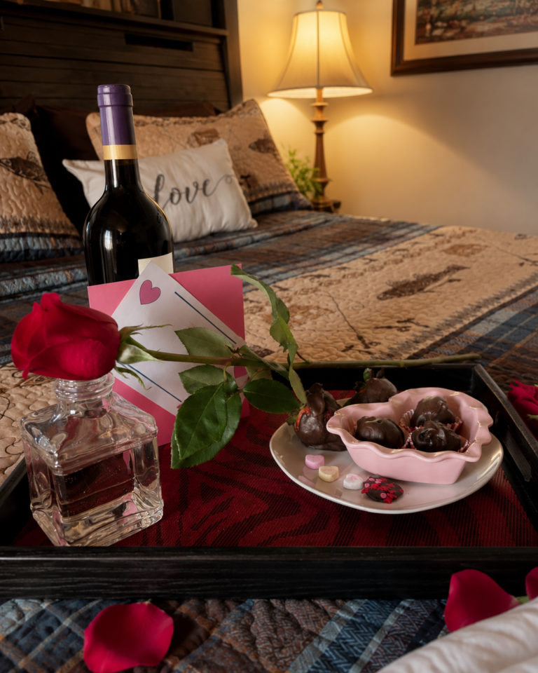 Romantic room package at Bedford Landings Bed & Breakfast with wine, roses, chocolates, and a cozy guest room setting near Smith Mountain Lake.