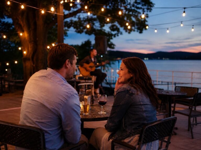 Couple enjoying a romantic evening with live music and lake views near Bedford Landings Bed & Breakfast at Smith Mountain Lake.