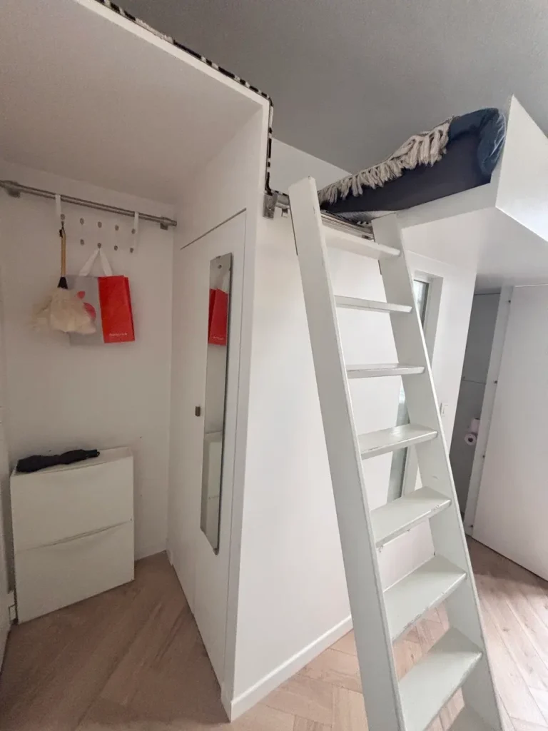 ompact vacation-rental interior in Paris illustrating the difference between an Airbnb-style rental and a traditional bed and breakfast